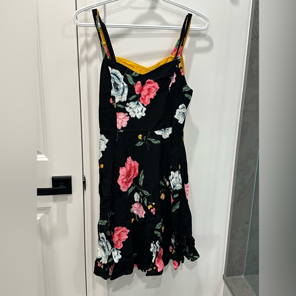 2 for the price of 1 black and yellow floral sun dresses. Old navy.